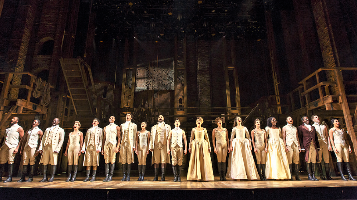 Cast of the musical Hamilton shown on stage ready to take a bow touring production photo credit Joan Marcus